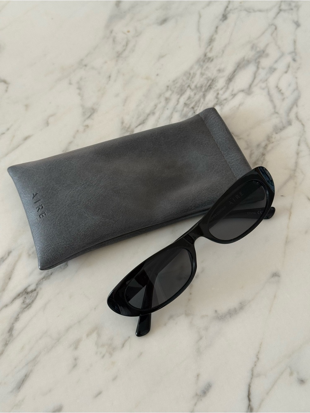Aire Sleek Black Cat-Eye Sunglasses with Grey Sleeve